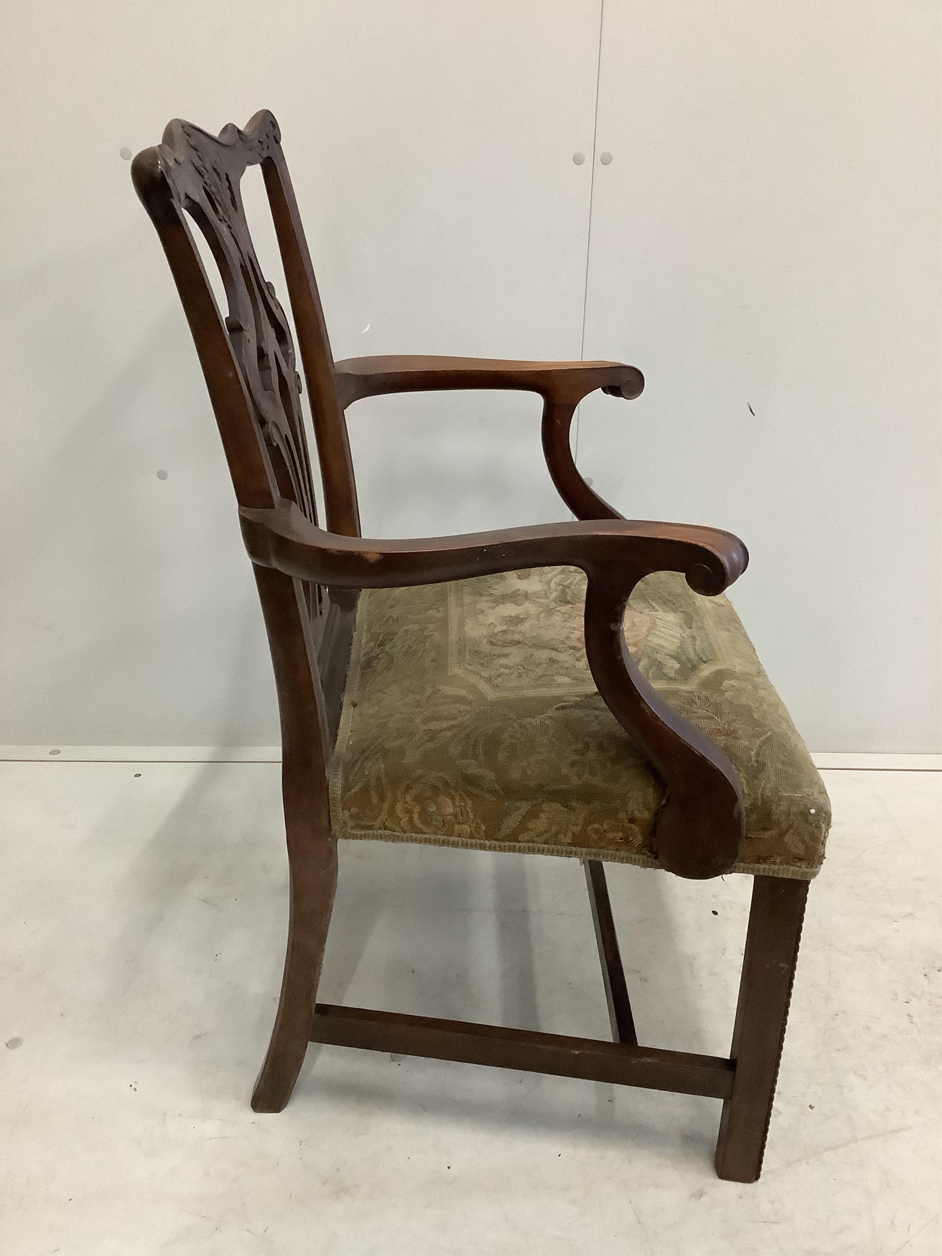 A Chippendale Revival mahogany dining suite comprising extending dining table, 210cm extended, two spare leaves, depth 106cm, height 75cm, bowfront sideboard and serving table, together with six dining chairs (two with a